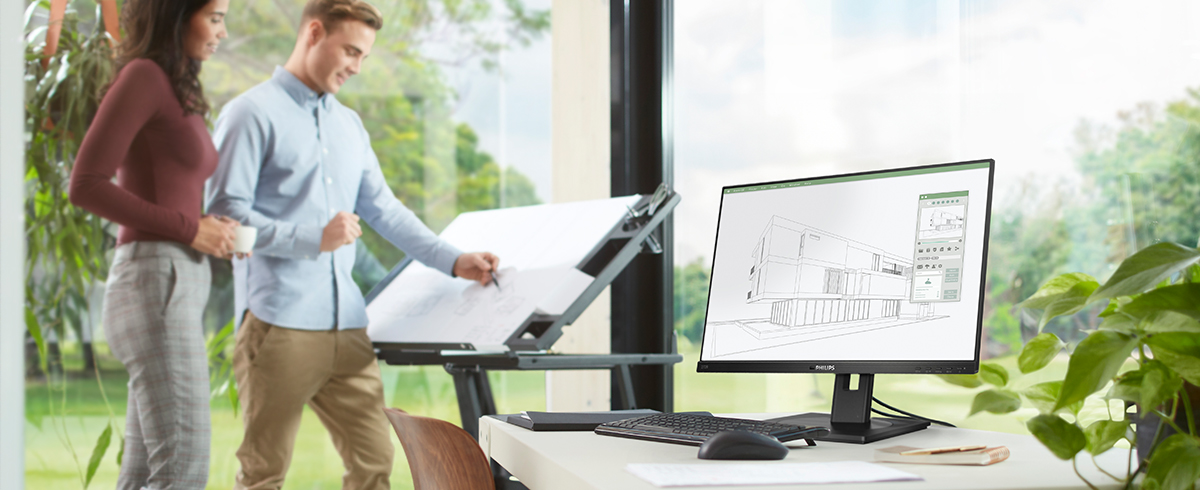 As pessoas estão a desfrutar do local de trabalho com os monitores verdes de baixo impacto da Philips.